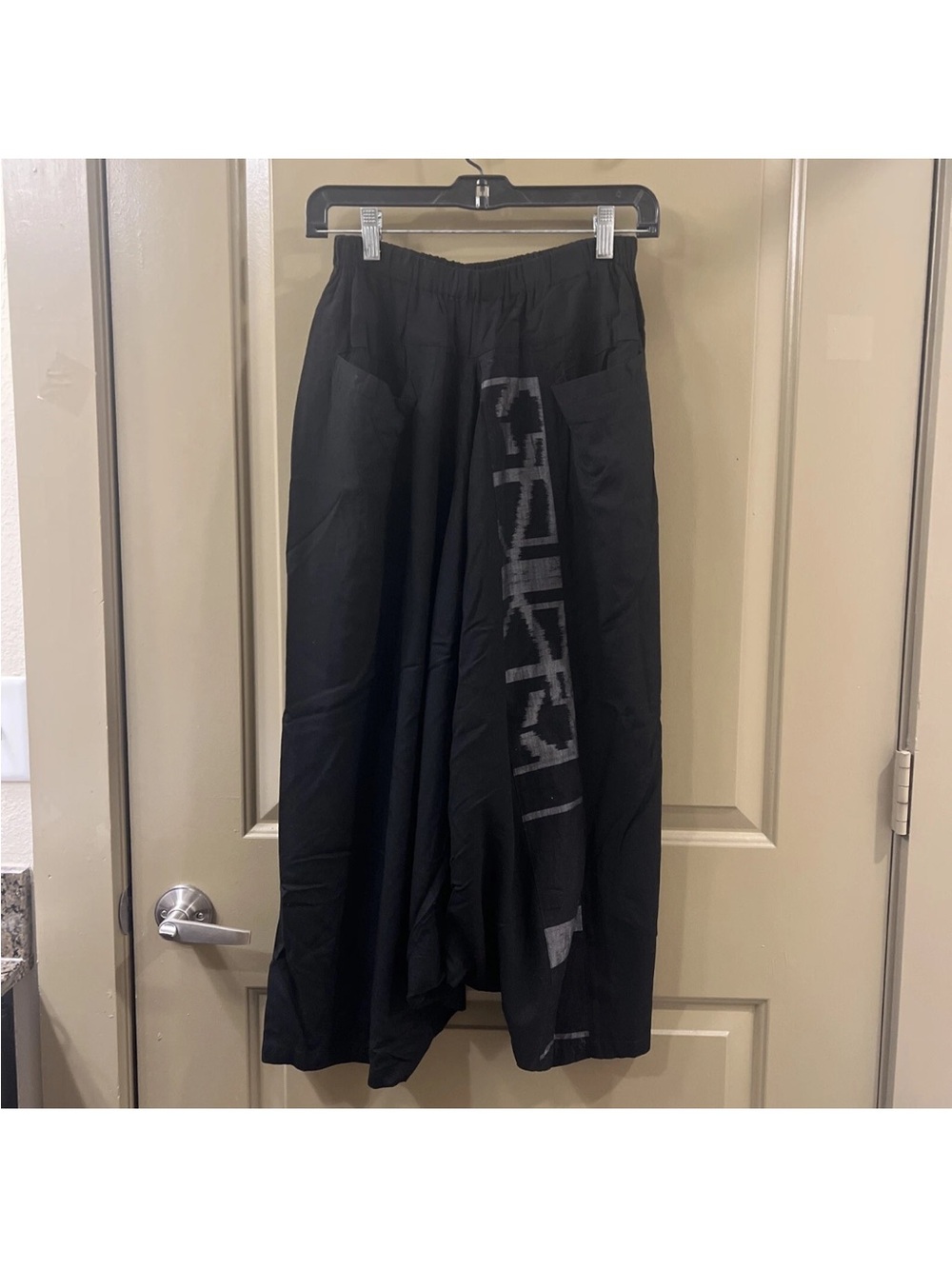 Moyuru Black Drop-Crotch Wide Sweatpants with Vertical Graphic